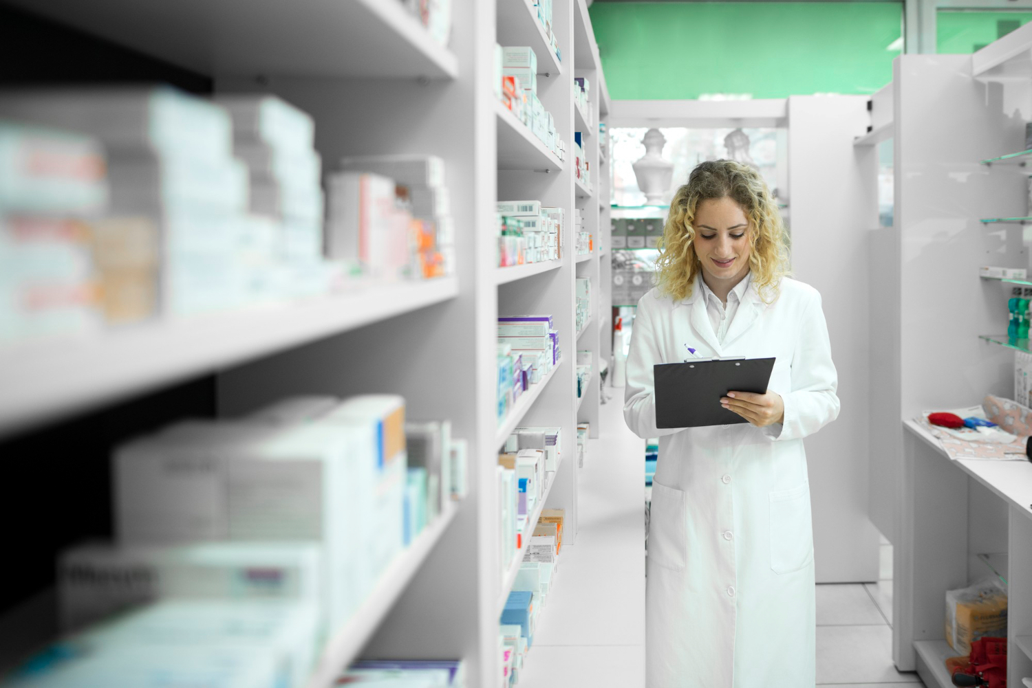 Pharmacist reviewing patient medication in a pharmacy